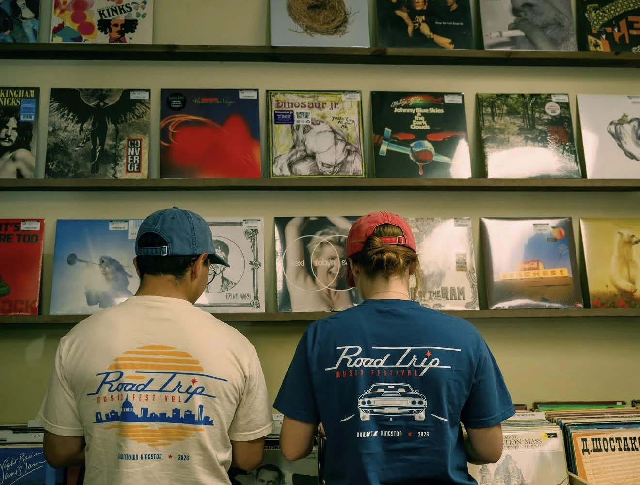 People wearing RoadTrip Festival shirts inside a record shop